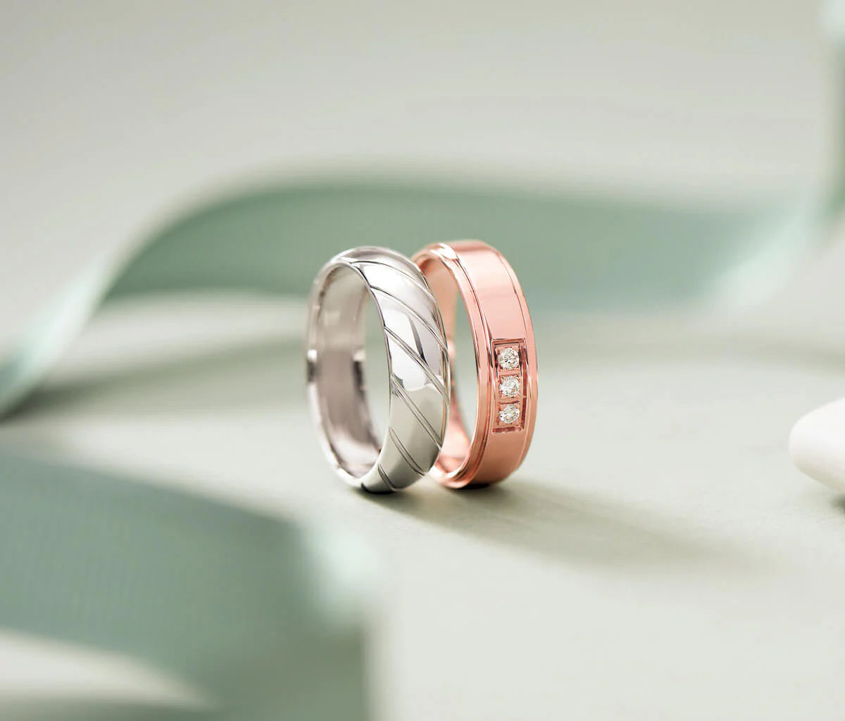 Men's wedding bands in classic gold, platinum, and alternative metals displayed at Talori in Newton.